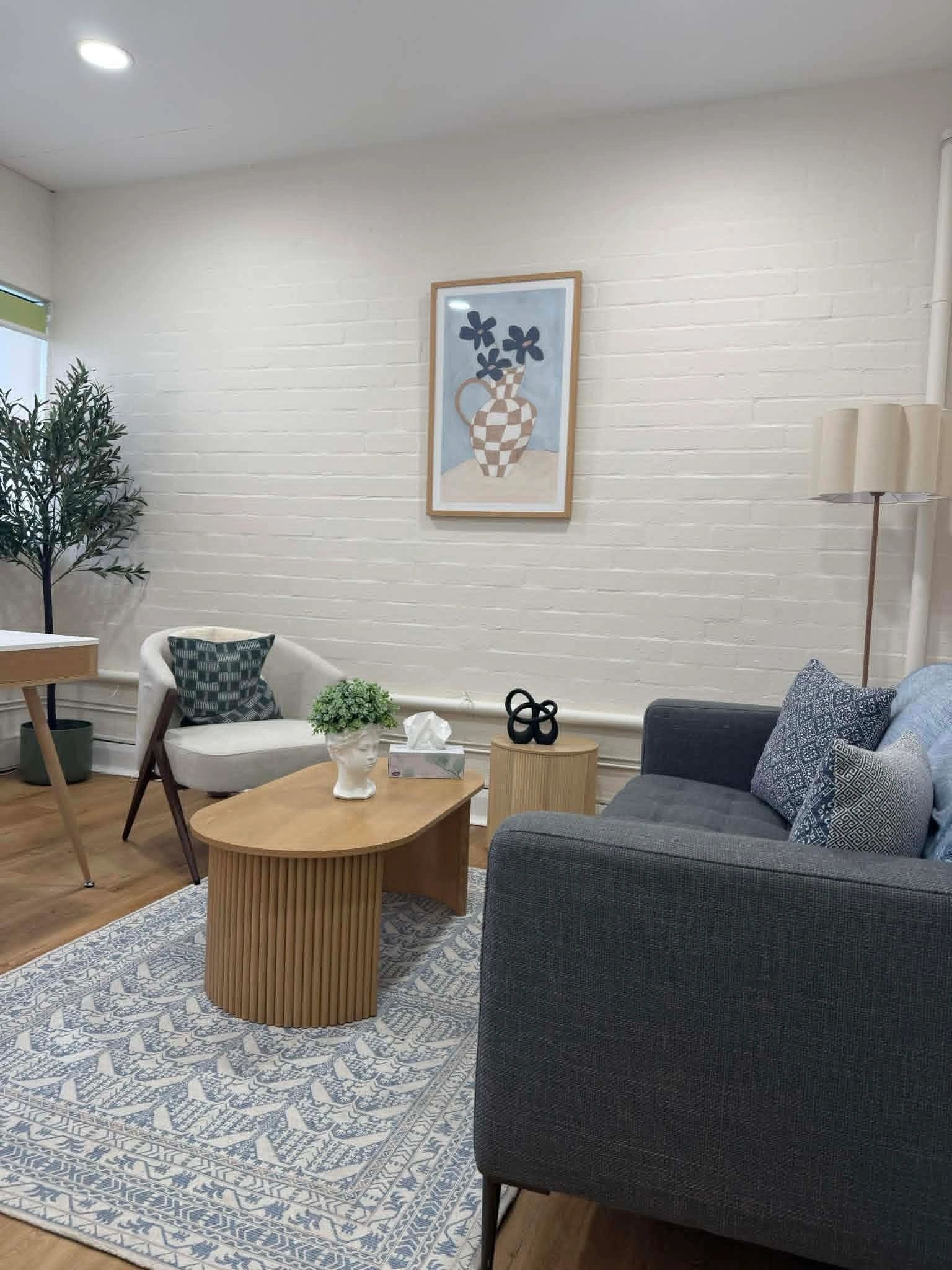 Inviting waiting area with soft seating and timber accents